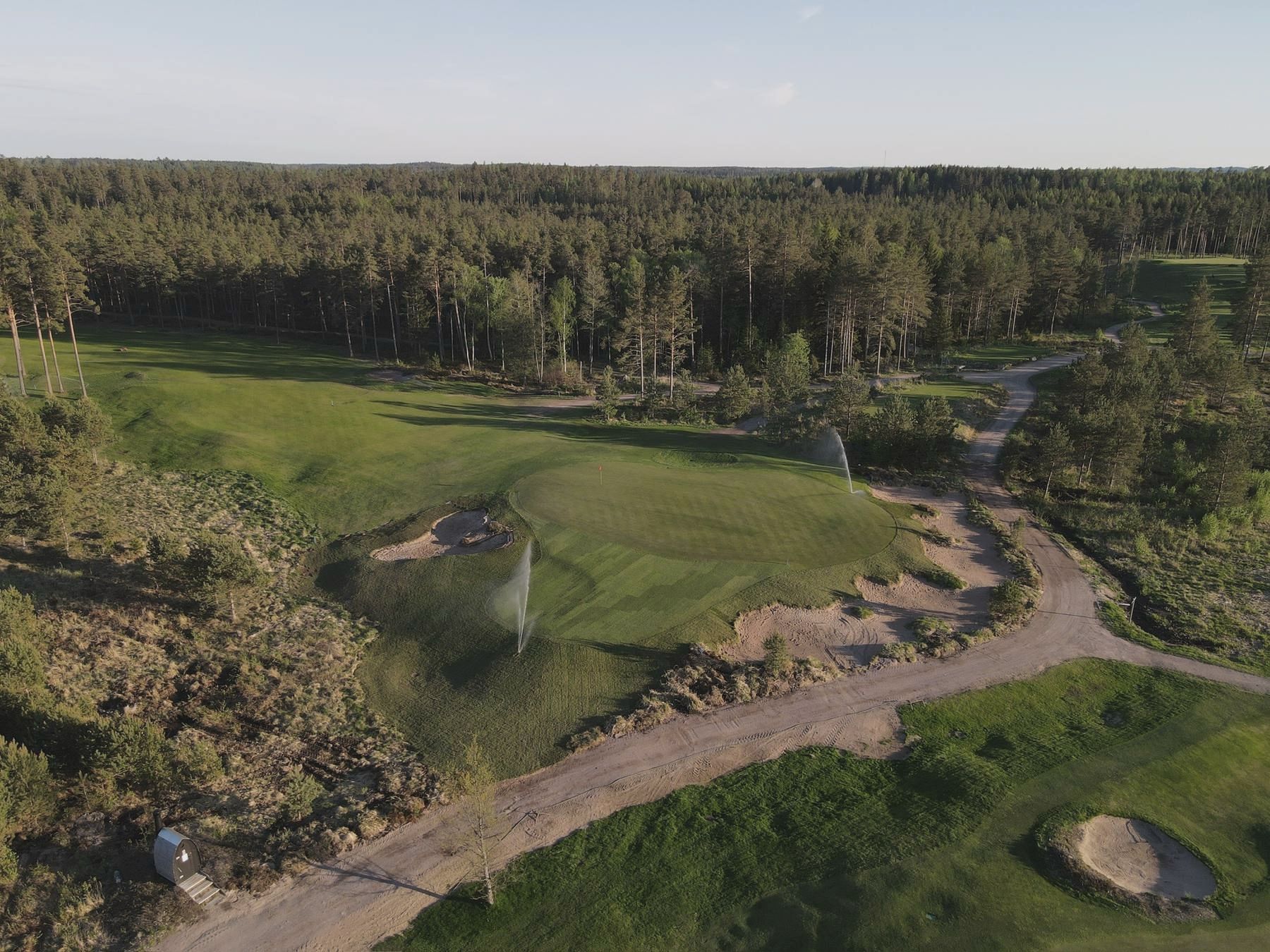 Aerial view over a green and its surrounds